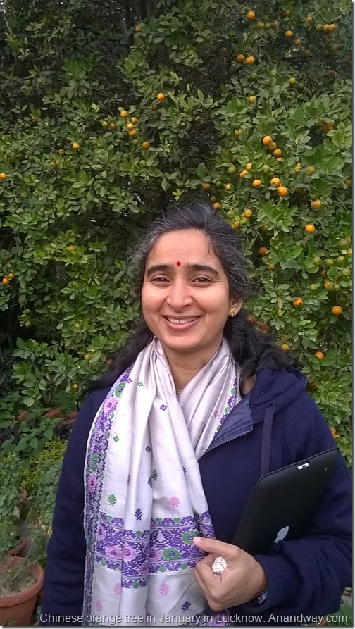 Anisha Sharma with tangerine trees in Lucknow